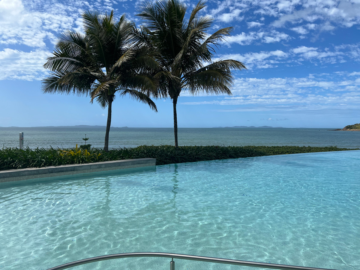 Photo looking at across a pool to the ocean